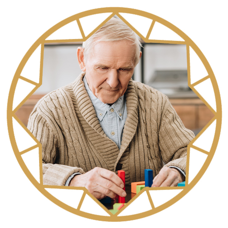 Memory care resident participating in art therapy at Opal Senior Living Reflections program